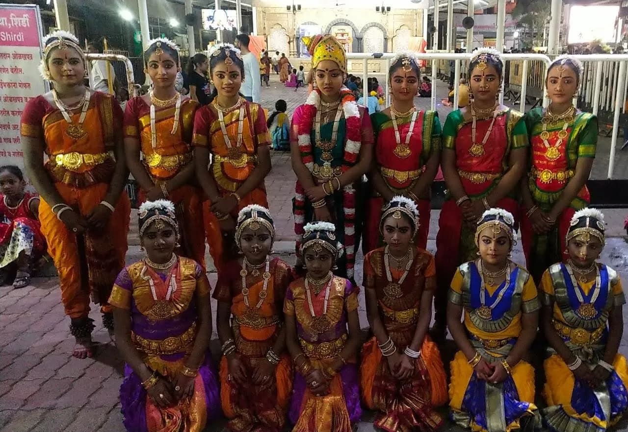 Young Bharatanatyam dancers in full costume at a temple festival — Uddharsha Foundation cultural event